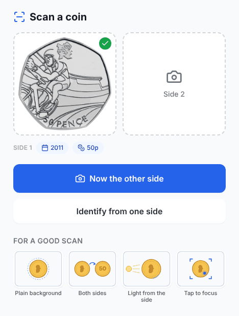 One side photographed: a 2011 Cycling 50p cut out with a green tick, 2011 and 50p read on it, and Now the other side